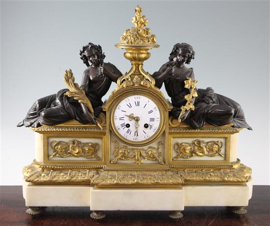 A 19th century French bronze, ormolu and white marble mantel clock, H.17in.